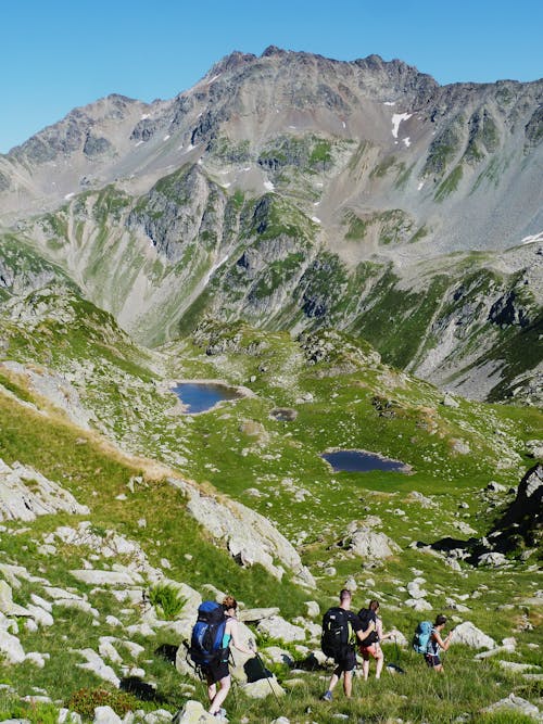 People Hiking on Mountains