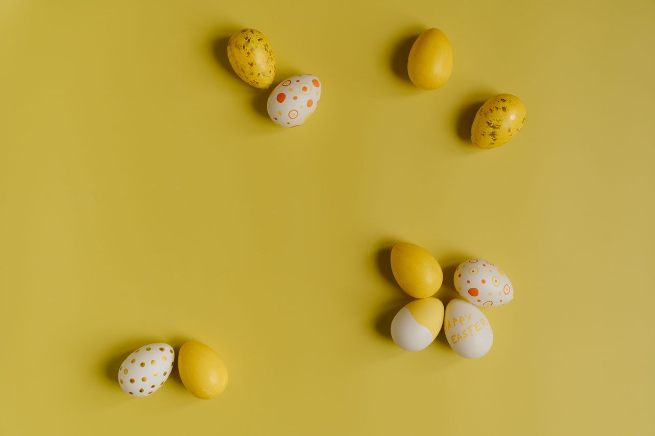 decorative easter eggs on a bright yellow surface perfect for holiday