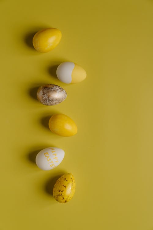 Arranged Eggs on Yellow Surface