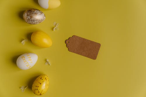 Close-Up Shot of Easter Eggs on a Yellow Surface