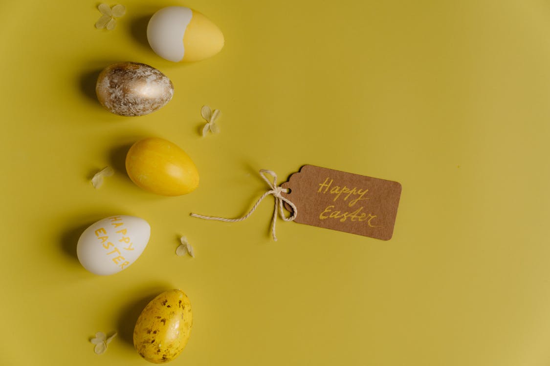 Close-Up Shot of Easter Eggs on a Yellow Surface