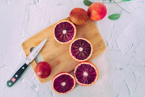 Sliced Blood Oranges on Wooden Chopping Board
