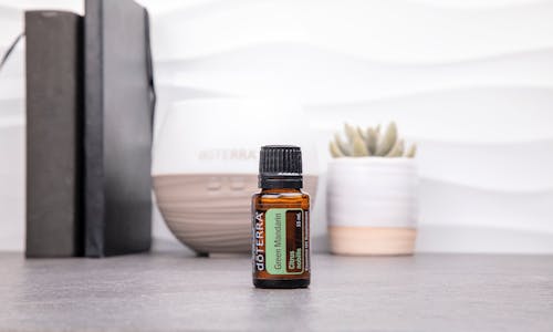 Brown Glass Bottle on White Table