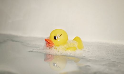 A yellow rubber duck in a foamy bath — Pătrașcu Bianca on Pexels
