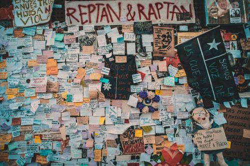 Free Colorful protest wall with messages in Santiago, Chile, expressing social and political sentiments. Stock Photo