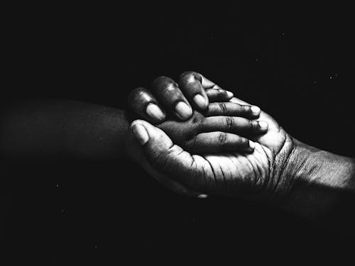 Free stock photo of black and white hands, black hands, mother and child hands Stock Photo