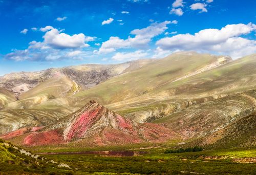 Free Vibrant hills under a blue sky captured in scenic landscape photography. Stock Photo