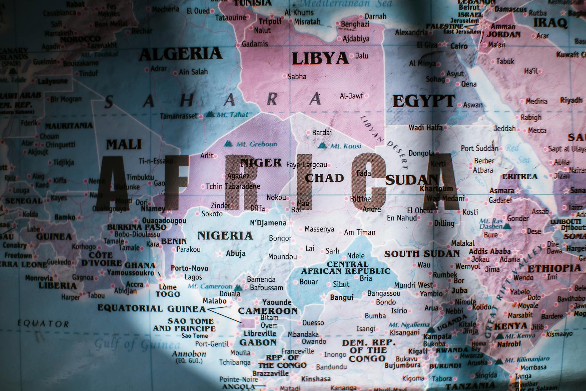 Closeup of map of Africa with countries borders and water on sunny day