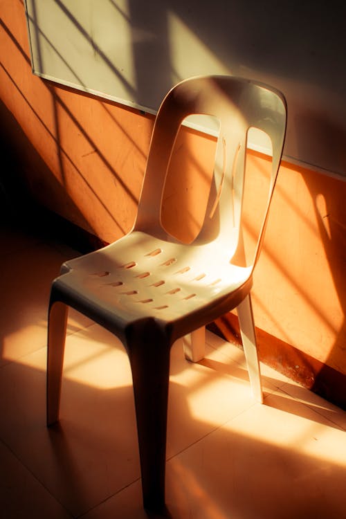 Free Chair near whiteboard in sunny classroom Stock Photo