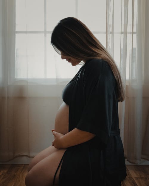 Free Pregnant Woman in Black Robe  Stock Photo