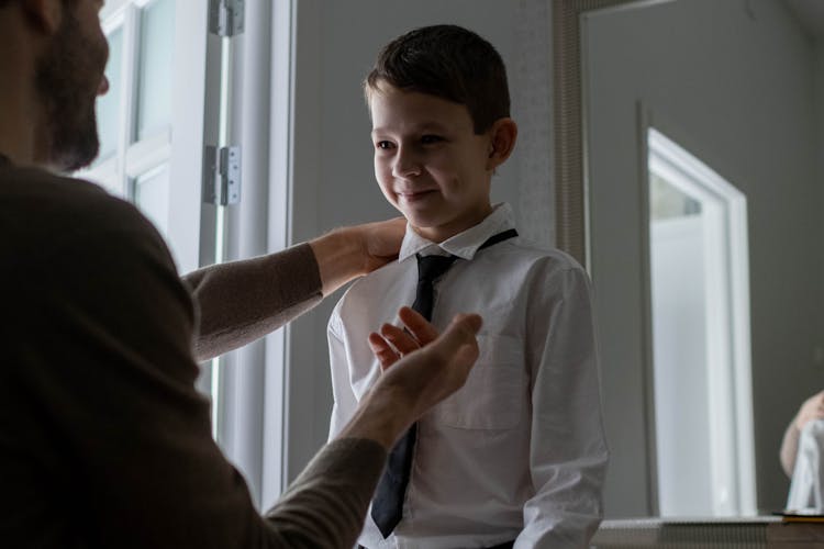 A Father Dressing His Son