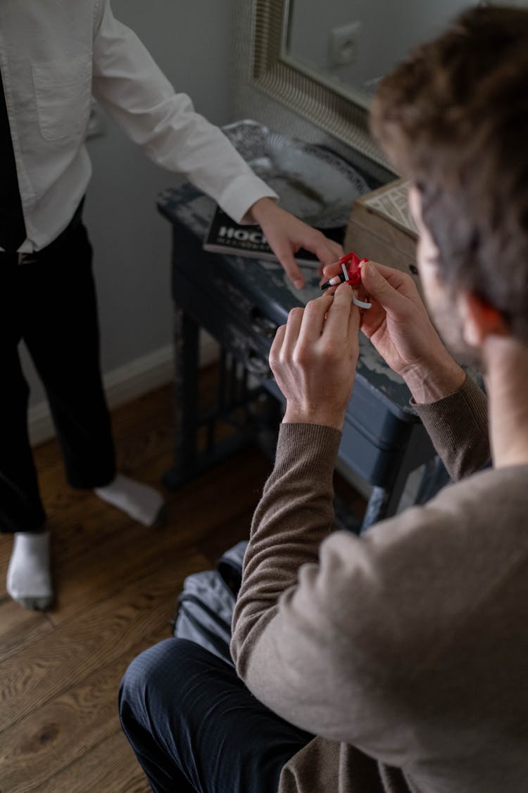 Man Holding A Toy Figure 