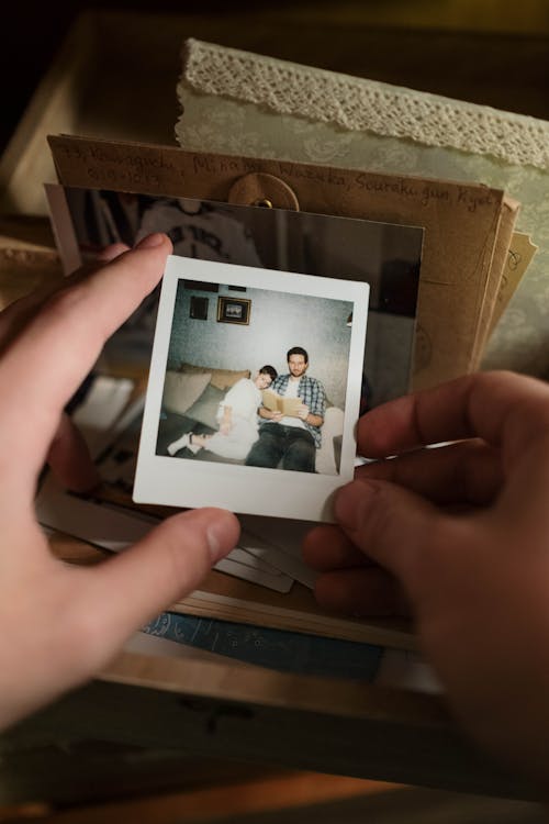 A Person Holding a Polaroid Picture 