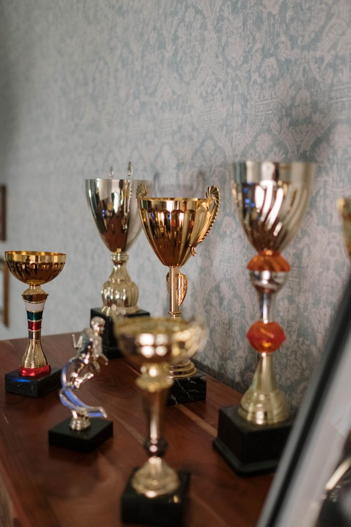 Collection of crystal trophies on a wooden surface