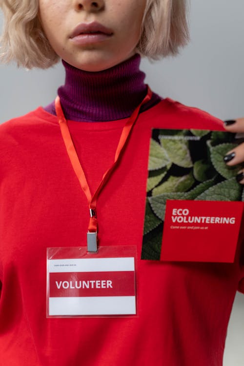 Free Close-up Photo of Personholding Red Brochure Stock Photo