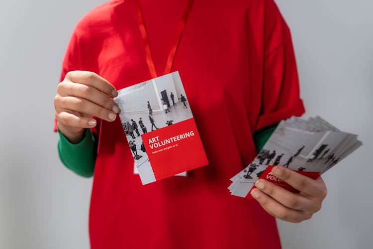 Close-up Photo Of Red Brochure