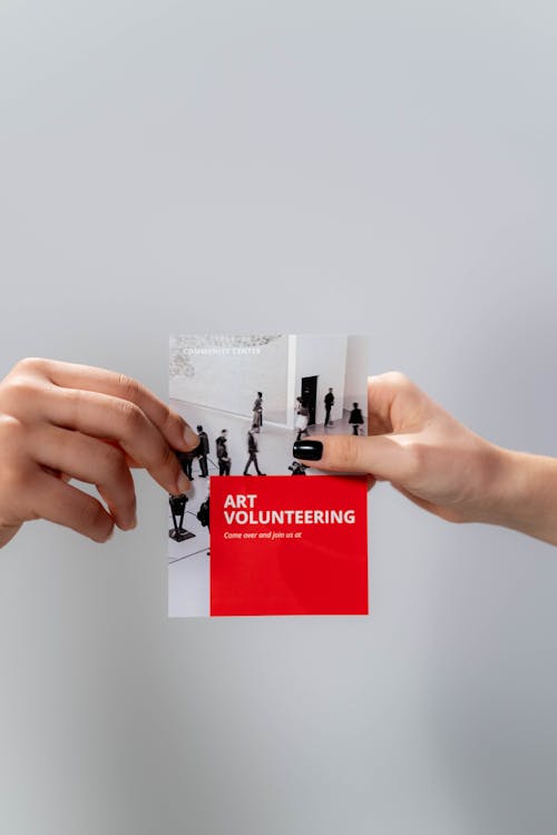 Free Hands holding Red Brochure Stock Photo