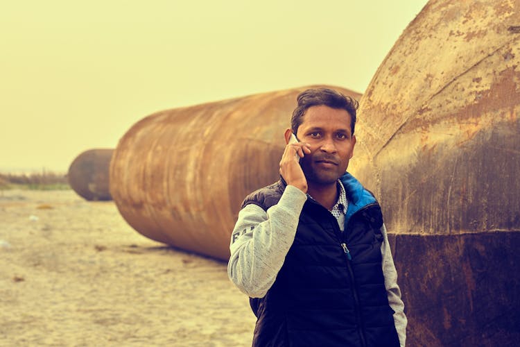 Man Talking On A Phone Outdoors