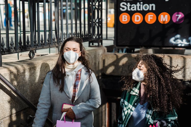 Diverse Women In Medical Masks Walking Out Of Metro