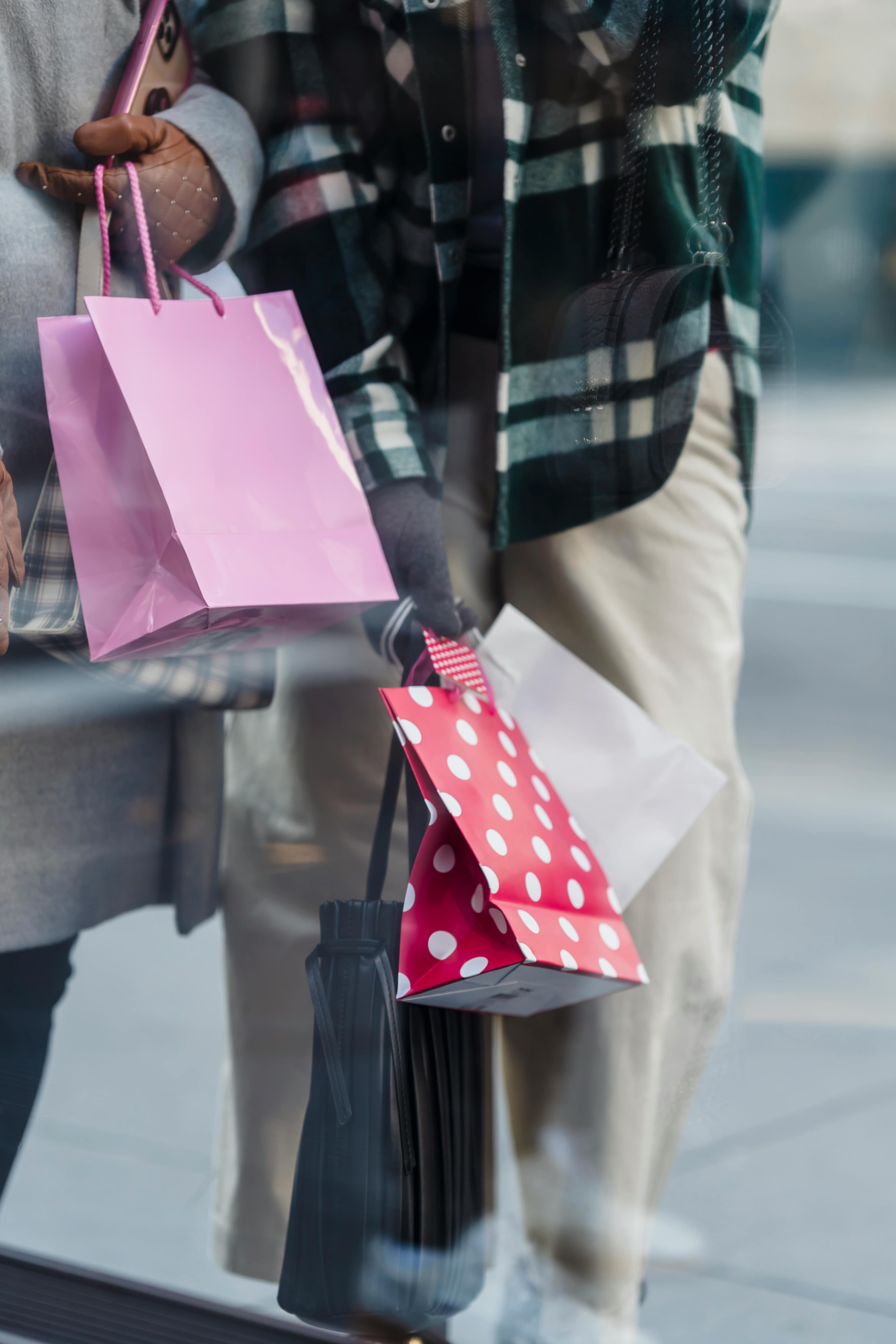 crop women with shopping bags