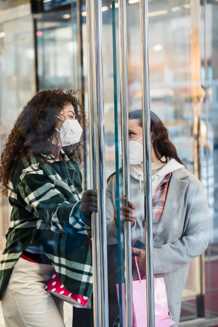 Content Diverse Women In Medical Mask Standing Near Store