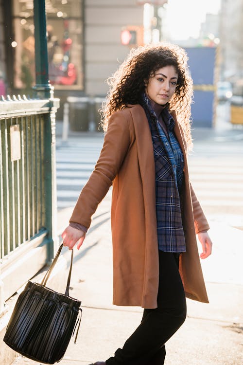 Stylish woman with trendy bag on street