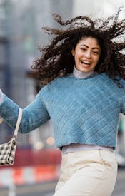 Free Happy woman jumping with shopping bags Stock Photo