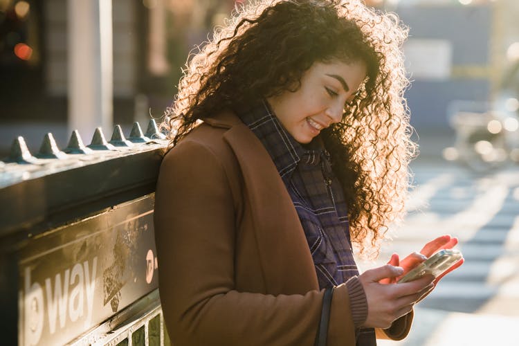 Tensed Woman Texting Message Outdoors Near Cafe