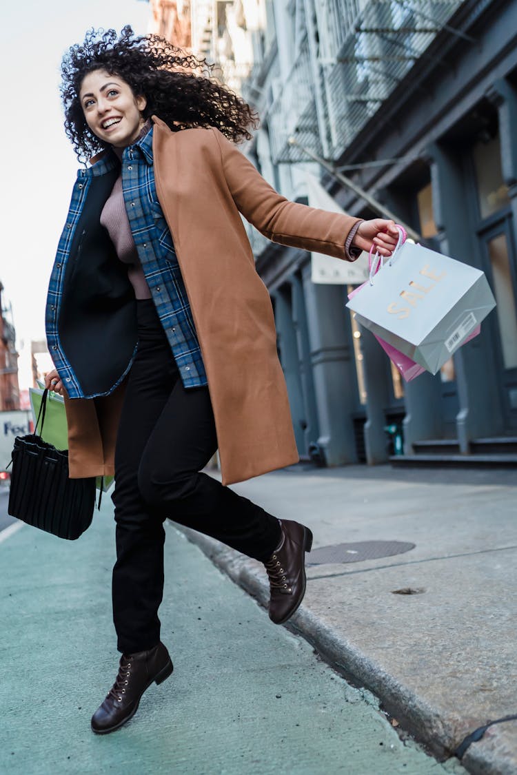 Smiling Ethnic Woman With Shopping Bags