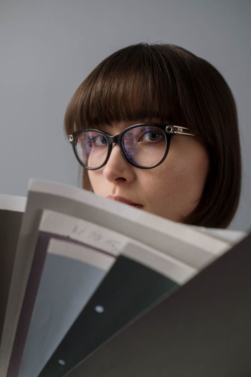Free Close-up portrait of a caucasian woman with glasses and brown hair. Stock Photo