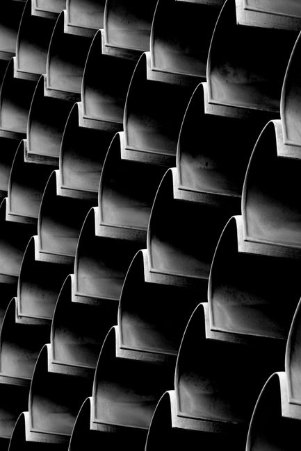 Black and white pattern of architectural shapes showing repetition and design complexity.