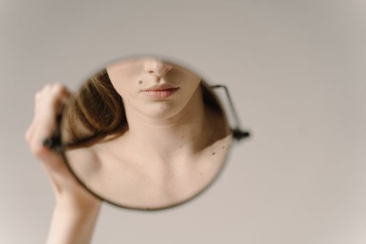 Reflection of a Mouth with Beauty Mark