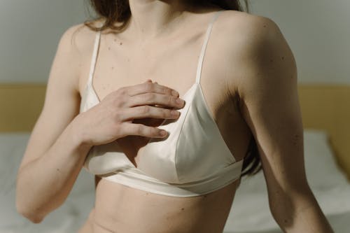 Free A Woman Touching Her Chest Stock Photo