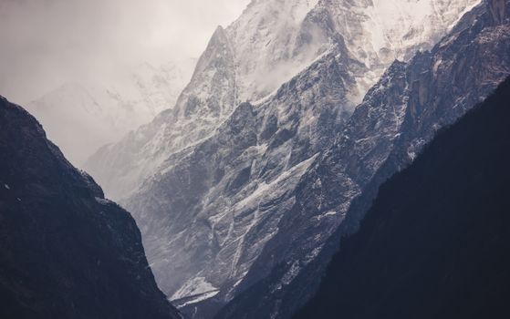 Stunning winter view of the Himalayas in Nepal, highlighting snow-covered peaks and dramatic mountain landscapes.