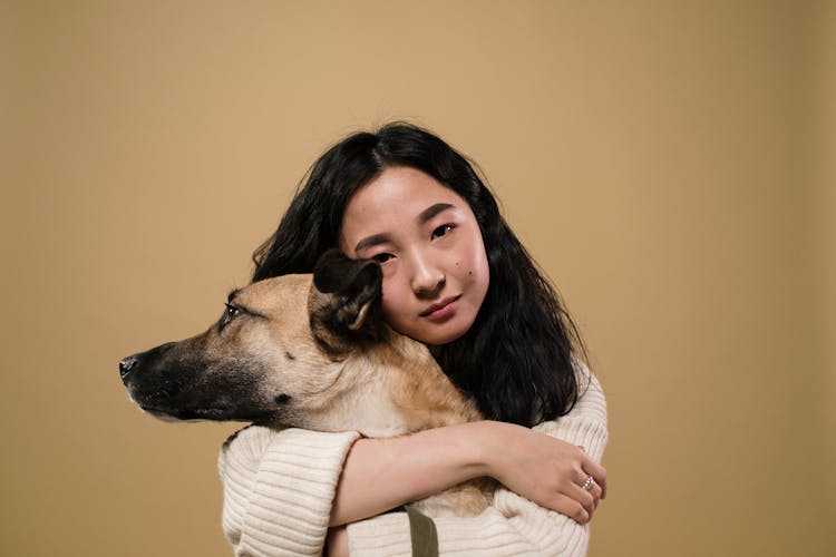 Owner Hugging Pet Dog 