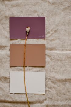Arrangement of color sample cards with poppy stem on neutral linen, showcasing a minimalist aesthetic.. pexels, arrangement, 