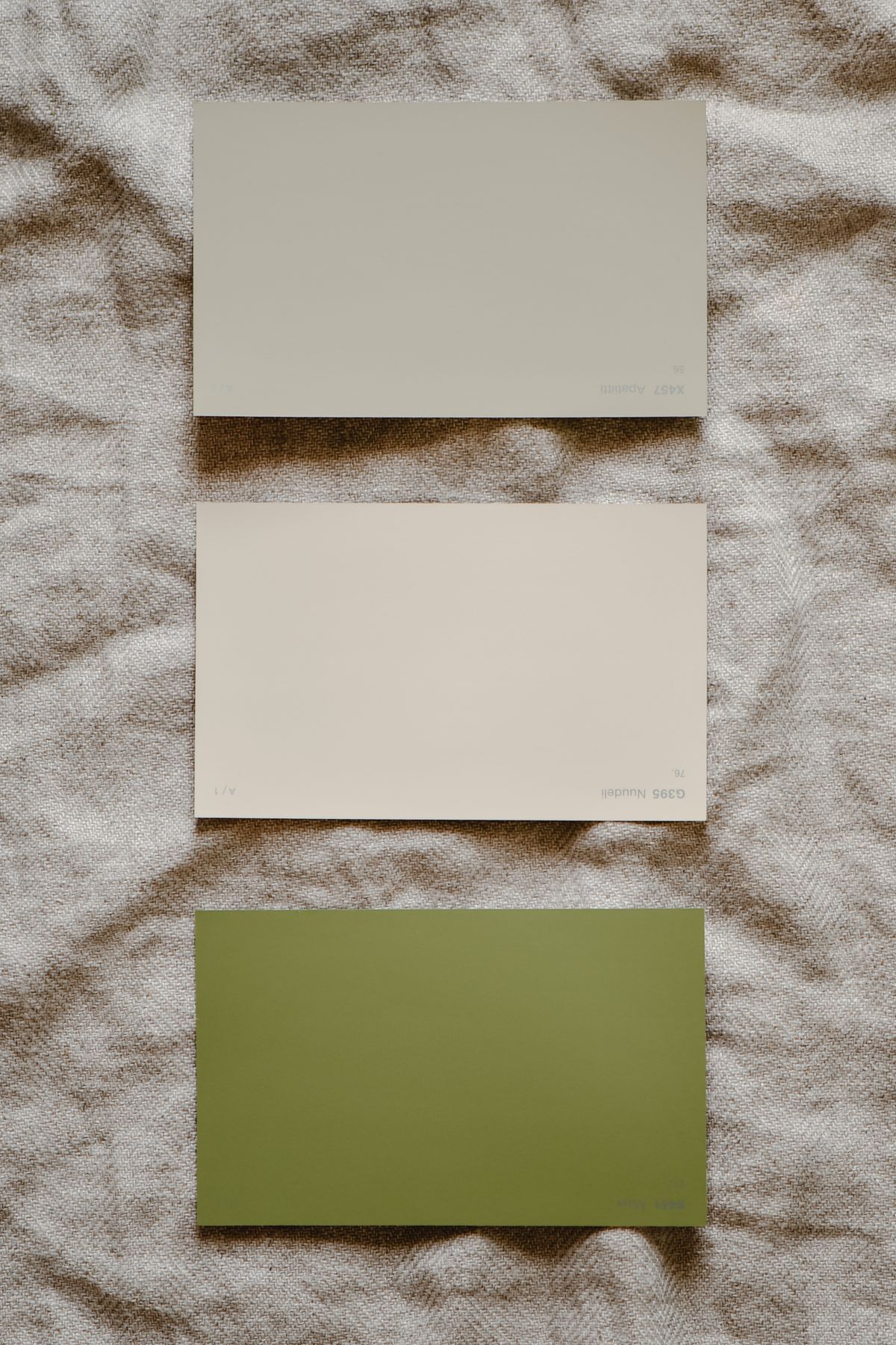Beige and grey paint colour samples side by side
