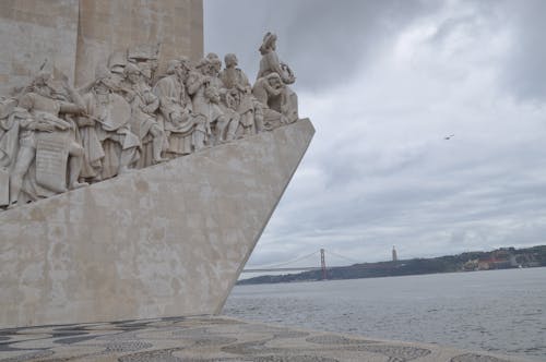 Free Concrete Statues Near the Ocean Stock Photo