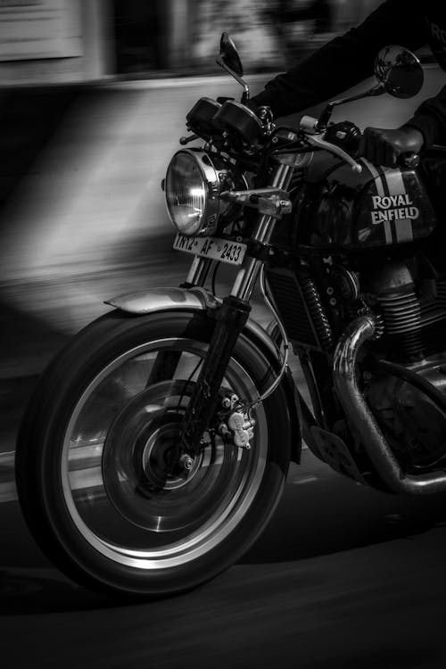 Grayscale Photo of Motorcycle on the Road
