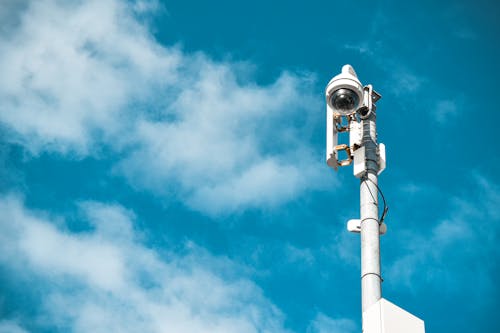 White CCTV Camera Under the Blue Sky