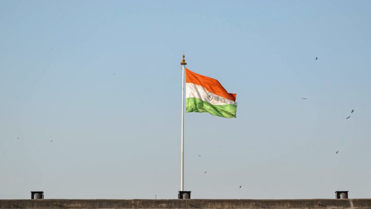 Waving Flag Under The Blue Sky