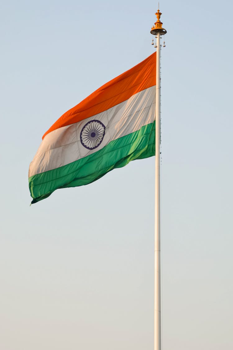 Waving Flag Under The Blue Sky