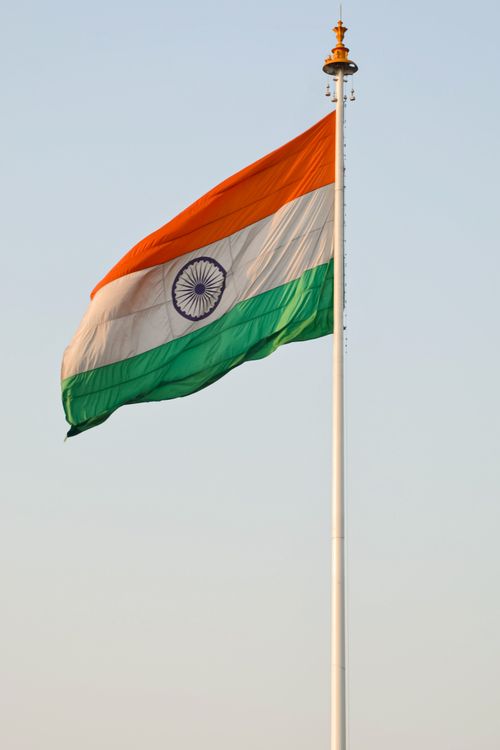 Free The Indian national flag waving majestically on a clear day, symbolizing patriotism and national pride. Stock Photo