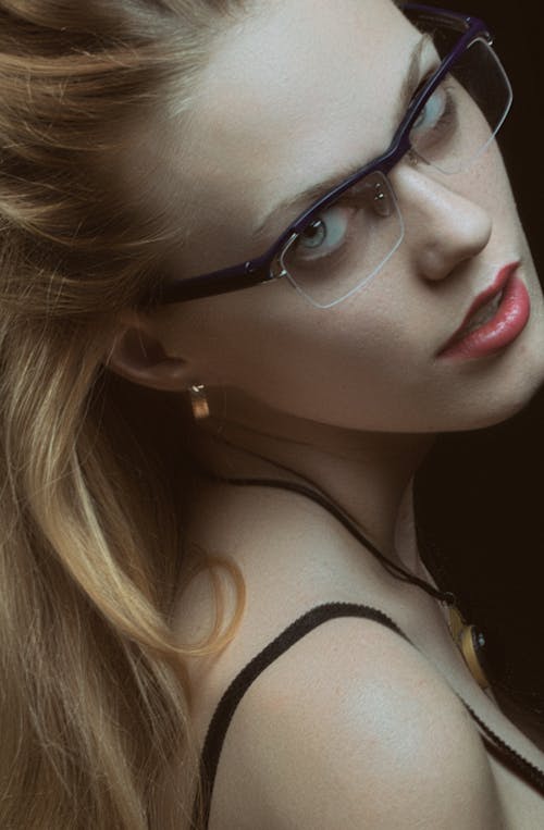 A Close-up Shot of a Woman Wearing Eyeglasses