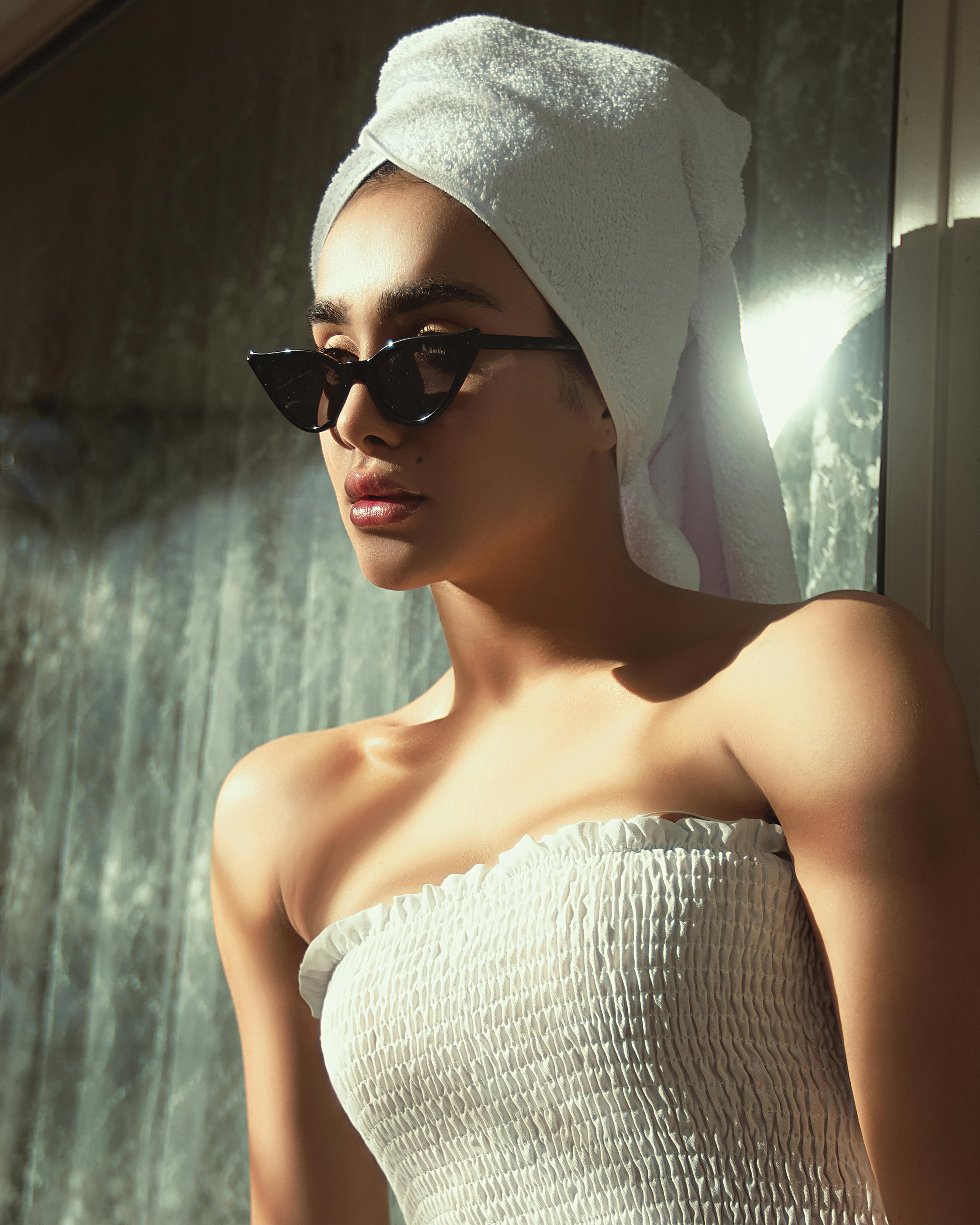 Free A Portrait of a Woman in a Head Towel and Sunglasses Stock Photo