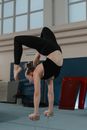 Woman in Black Tank Top and Black Leggings Doing Yoga