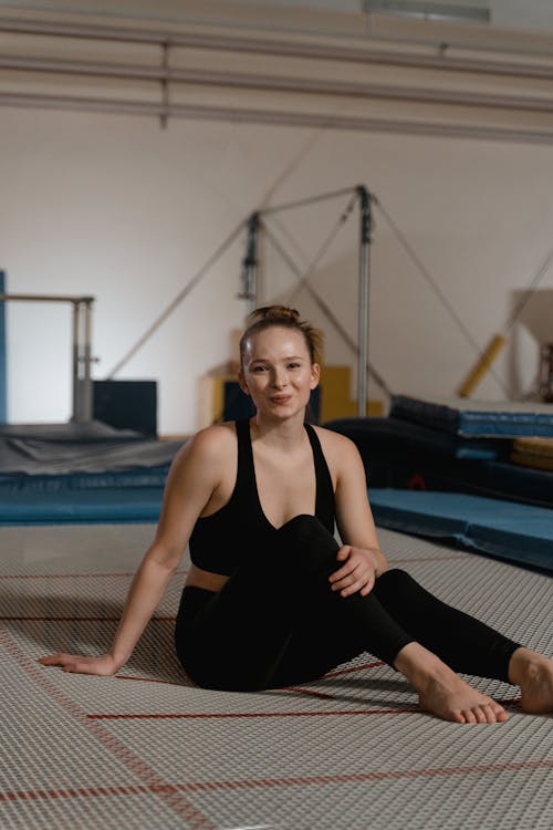 A Woman in Activewear Sitting on the Floor