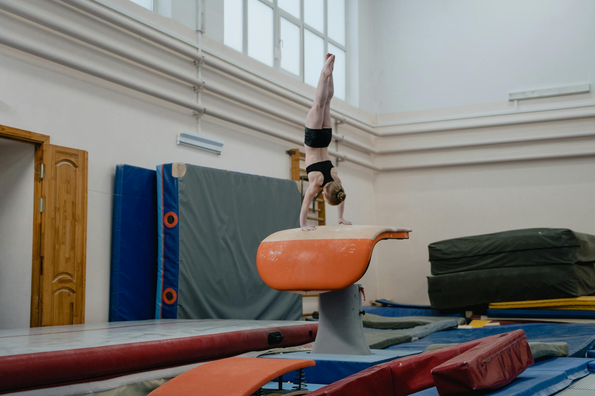 A Girl Doing a Handstand on a Vaulting Table