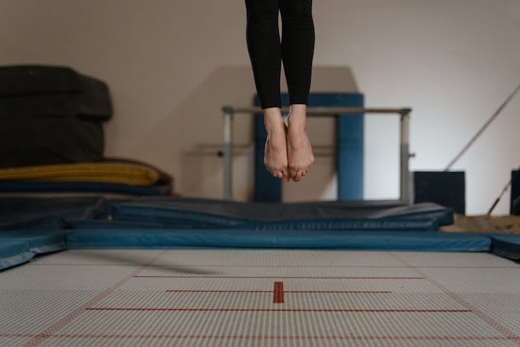 A Person Jumping On A Trampoline