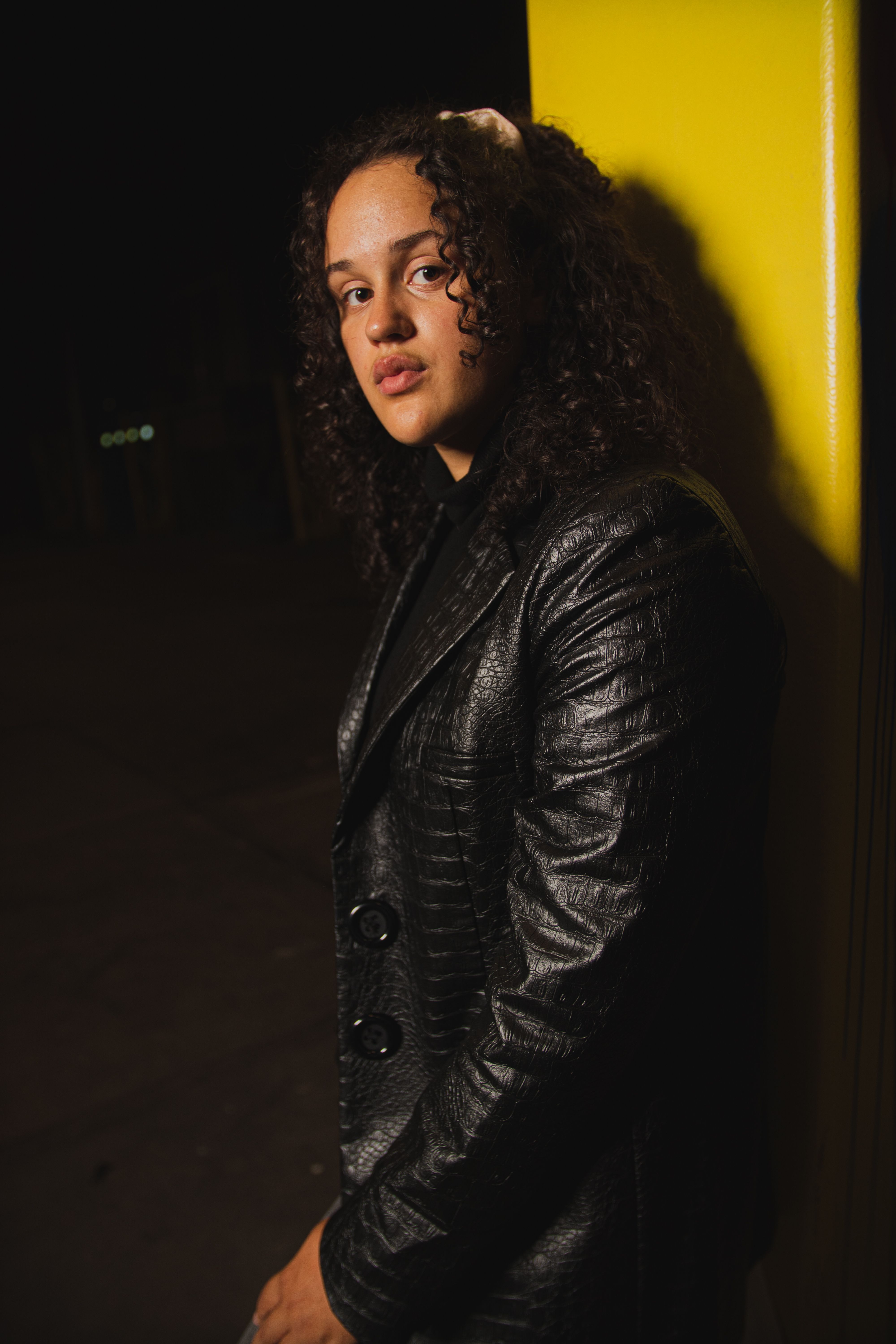 Woman with Curly Hair and a Black Leather Jacket · Free Stock Photo